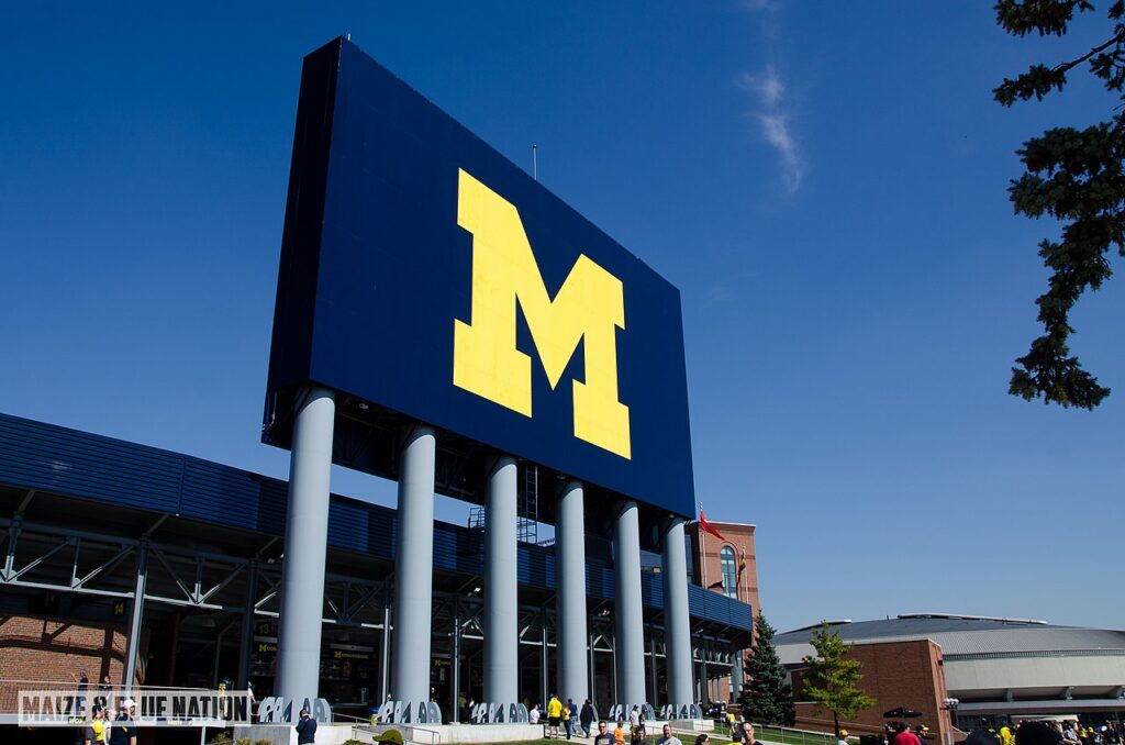 A blue and white sign with a prominent 'M' on it, representing a clear and identifiable marker.