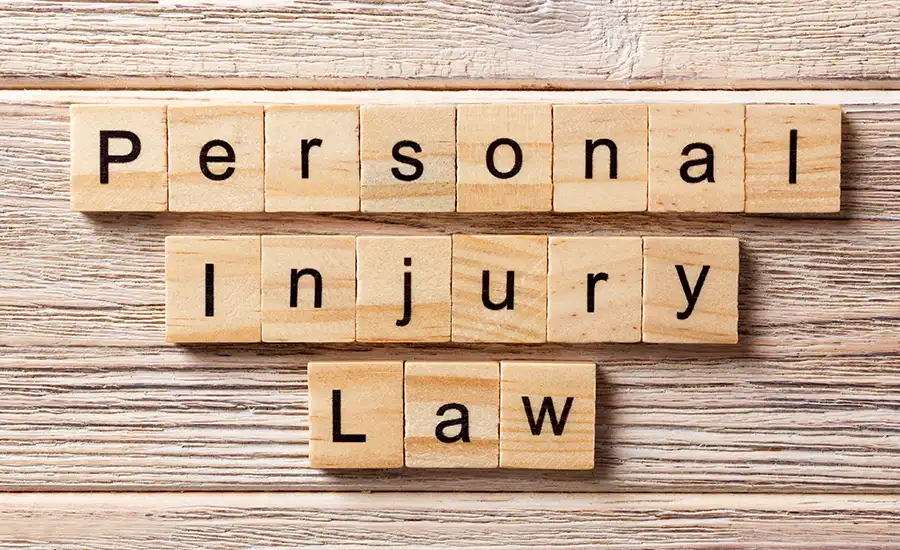 Personal injury law - wooden blocks. Symbolic representation of legal concepts and justice in personal injury cases.