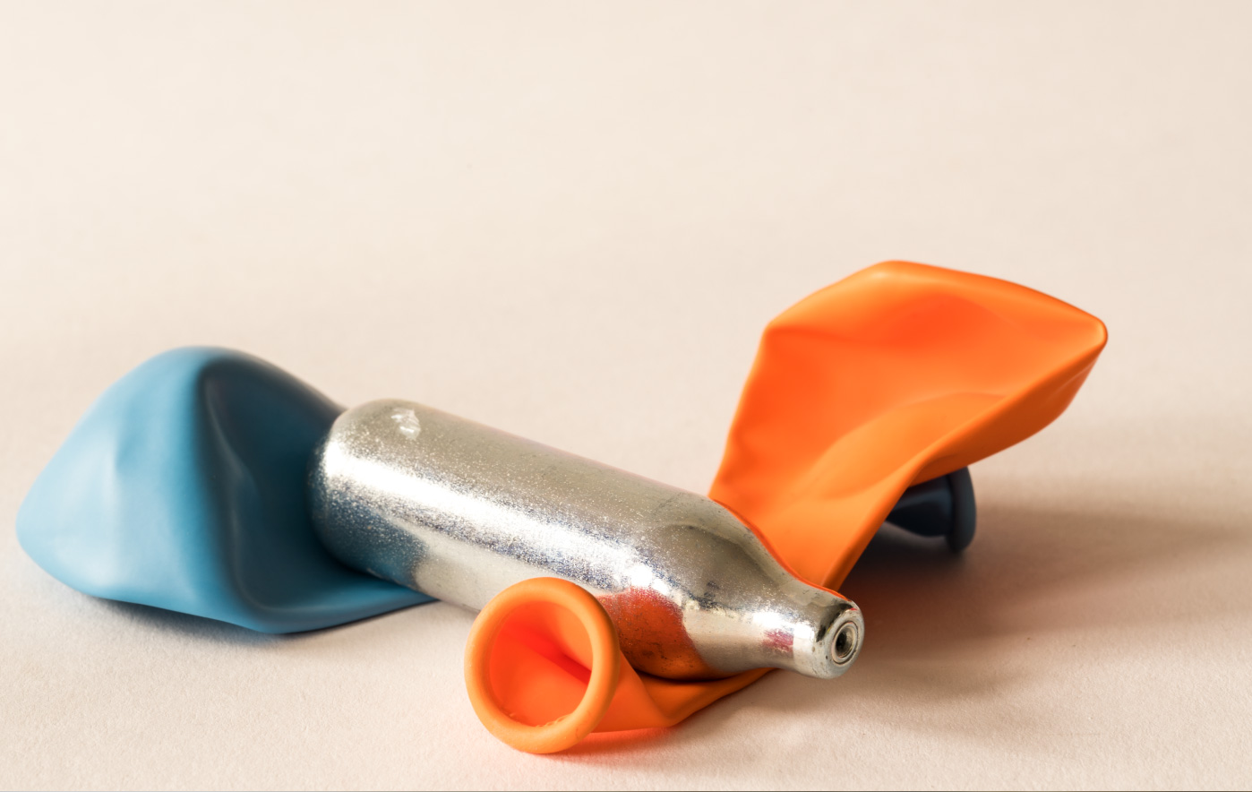 Small nitrous oxide canisters and chargers associated with recreational nitrous oxide abuse